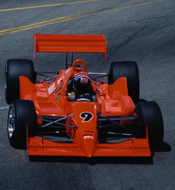 Red Formula 1 Race car in turn on track